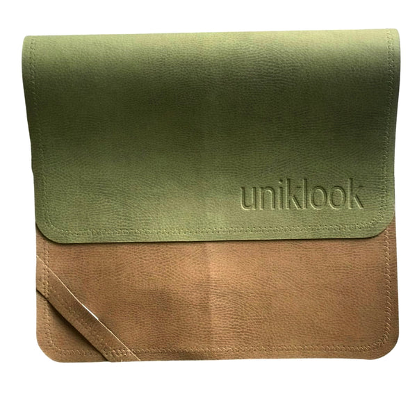 A hunter green and tan foldable changing mat with zigzag stitching and the brand name 'uniLOOK' embossed on the top corner.